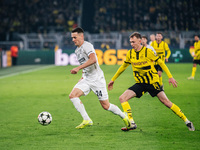 Maximilian Beier of Borussia Dortmund and Dimitri Lavalee of SK Sturm Graz are in action during the UEFA Champions League 2024/25 League Pha...