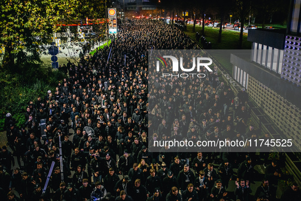 Fans of SK Sturm Graz march to the stadium before the UEFA Champions League 2024/25 League Phase MD4 soccer match between Borussia Dortmund...