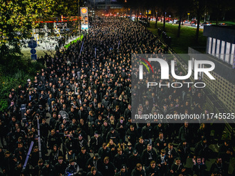 Fans of SK Sturm Graz march to the stadium before the UEFA Champions League 2024/25 League Phase MD4 soccer match between Borussia Dortmund...