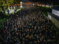 Fans of SK Sturm Graz march to the stadium before the UEFA Champions League 2024/25 League Phase MD4 soccer match between Borussia Dortmund...