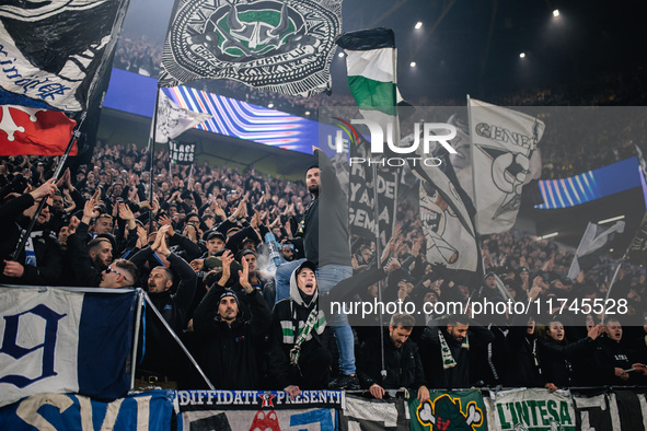 Fans of SK Sturm Graz cheer for their team during the UEFA Champions League 2024/25 League Phase MD4 soccer match between Borussia Dortmund...