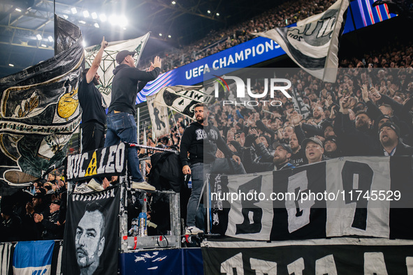 Fans of SK Sturm Graz cheer for their team during the UEFA Champions League 2024/25 League Phase MD4 soccer match between Borussia Dortmund...