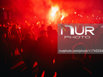 Fans of SK Sturm Graz march to the stadium before the UEFA Champions League 2024/25 League Phase MD4 soccer match between Borussia Dortmund...