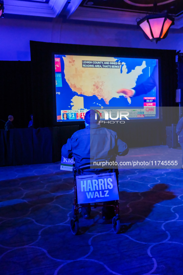 Attendees watch television coverage of the United States 2024 election at the Minnesota DFL Election Night event at the InterContinental Hot...