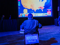 Attendees watch television coverage of the United States 2024 election at the Minnesota DFL Election Night event at the InterContinental Hot...