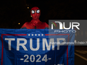 A person dressed as Spiderman holds a banner with the text ''Trump 2024'' in Black Lives Matter Plaza in Washington DC, USA, on November 5,...