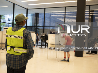 People vote at a local polling station in Washington, DC, on November 5, 2024. (