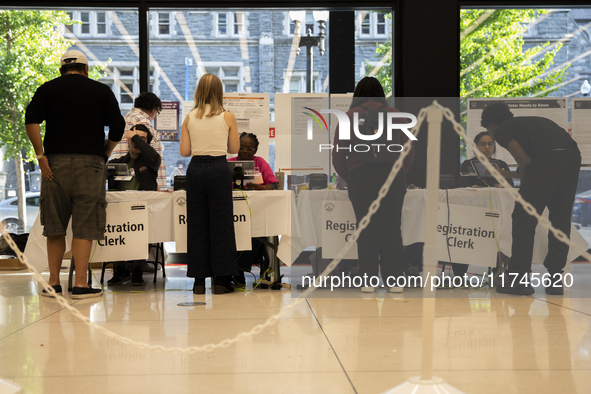 Voters stand in line at a local polling station in Washington, DC, on November 5, 2024. 