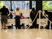 Voters stand in line at a local polling station in Washington, DC, on November 5, 2024. (