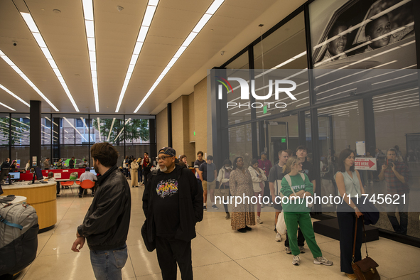 Voters stand in line at a local polling station in Washington, DC, on November 5, 2024. 