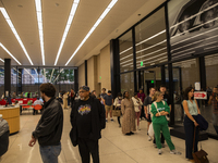 Voters stand in line at a local polling station in Washington, DC, on November 5, 2024. (