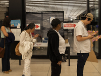 Voters stand in line at a local polling station in Washington, DC, on November 5, 2024. (