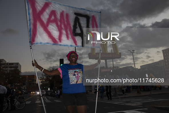 A person holds a sign during an election night event with US Vice President Kamala Harris at Howard University in Washington, DC, US, on Nov...