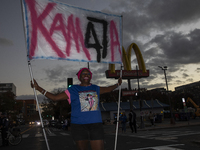 A person holds a sign during an election night event with US Vice President Kamala Harris at Howard University in Washington, DC, US, on Nov...