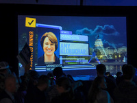 A TV screen shows the victory of United States Senator Amy Klobuchar at the Minnesota DFL Election Night event at the InterContinental Hotel...