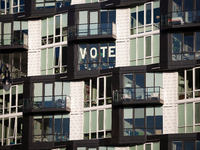 A sign in an apartment window near Howard University calls on Americans to vote, Washington, DC, on November 5, 2024.  Voters are choosing t...