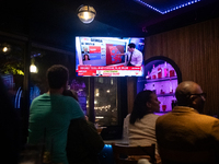 People watch the 2024 election results during a watch party at the Admiral in Washington, DC, on November 5, 2024.  Voters are choosing the...