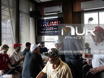 Republican Party supporters gather at a roadhouse restaurant to view U.S. media coverage of the U.S. presidential election in Bangkok, Thail...