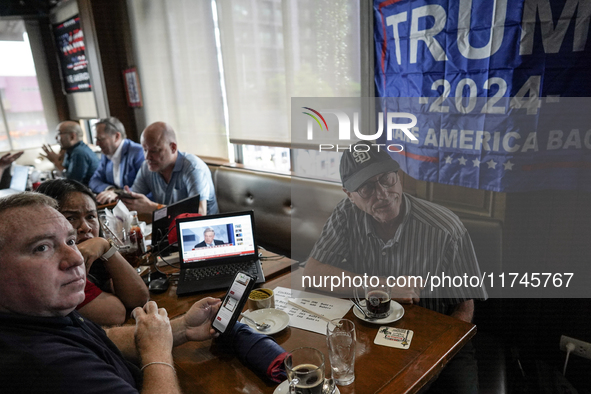 Republican Party supporters gather at a roadhouse restaurant to view U.S. media coverage of the U.S. presidential election in Bangkok, Thail...