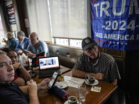 Republican Party supporters gather at a roadhouse restaurant to view U.S. media coverage of the U.S. presidential election in Bangkok, Thail...