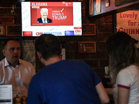 Democrat Party supporters gather at a roadhouse restaurant to view U.S. media coverage of the U.S. presidential election in Bangkok, Thailan...