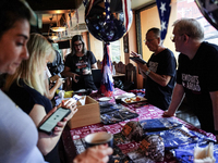 Democrat Party supporters gather at a roadhouse restaurant to view U.S. media coverage of the U.S. presidential election in Bangkok, Thailan...