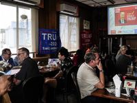 Republican Party supporters gather at a roadhouse restaurant to view U.S. media coverage of the U.S. presidential election in Bangkok, Thail...