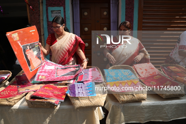 A woman arranges free religious materials to distribute to devotees who will perform prayers ahead of the Hindu religious festival of Chhat...