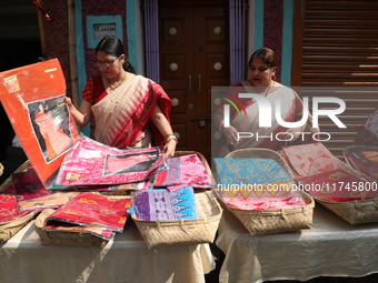 A woman arranges free religious materials to distribute to devotees who will perform prayers ahead of the Hindu religious festival of Chhat...