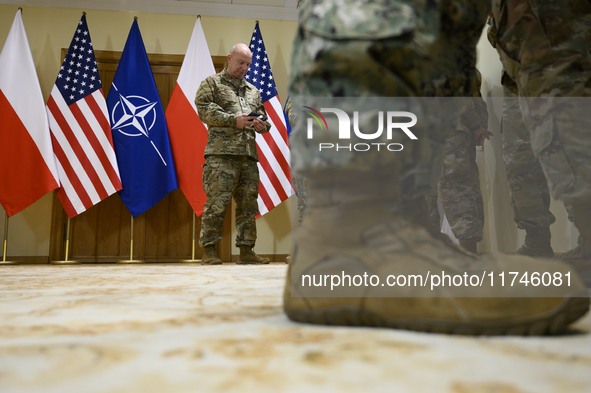 U.S. soldiers stationed in Poland wait before the medals award ceremony held by Poland's Deputy Prime Minister and Defence Minister, Wladysl...