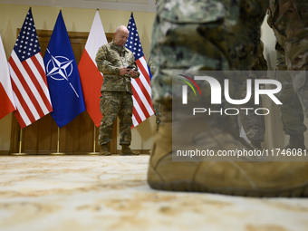 U.S. soldiers stationed in Poland wait before the medals award ceremony held by Poland's Deputy Prime Minister and Defence Minister, Wladysl...