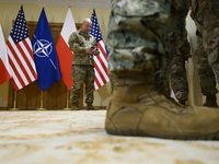 U.S. soldiers stationed in Poland wait before the medals award ceremony held by Poland's Deputy Prime Minister and Defence Minister, Wladysl...