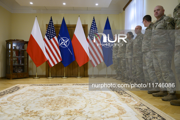 U.S. soldiers stationed in Poland wait before the medals award ceremony held by Poland's Deputy Prime Minister and Defence Minister, Wladysl...