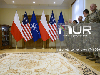 U.S. soldiers stationed in Poland wait before the medals award ceremony held by Poland's Deputy Prime Minister and Defence Minister, Wladysl...