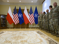 U.S. soldiers stationed in Poland wait before the medals award ceremony held by Poland's Deputy Prime Minister and Defence Minister, Wladysl...