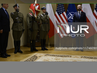 Poland's Deputy Prime Minister and Defence Minister, Wladyslaw Kosiniak-Kamysz, awards U.S. soldiers stationed in Poland for their service i...