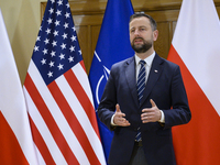 Poland's Deputy Prime Minister and Defence Minister, Wladyslaw Kosiniak-Kamysz, awards U.S. soldiers stationed in Poland for their service i...