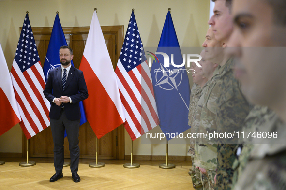 Poland's Deputy Prime Minister and Defence Minister, Wladyslaw Kosiniak-Kamysz, awards U.S. soldiers stationed in Poland for their service i...