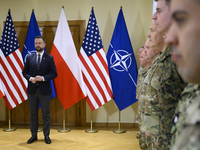 Poland's Deputy Prime Minister and Defence Minister, Wladyslaw Kosiniak-Kamysz, awards U.S. soldiers stationed in Poland for their service i...