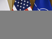 The flags of the USA, NATO, and Poland are pictured before the U.S. soldiers' medal award ceremony at the Ministry of Defence in Warsaw, Pol...