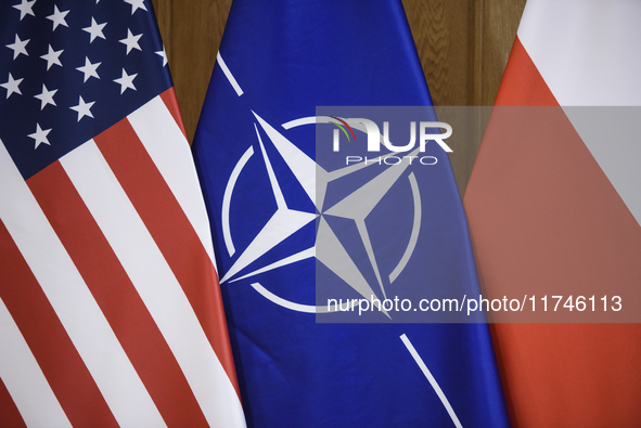 The flags of the USA, NATO, and Poland are pictured before the U.S. soldiers' medal award ceremony at the Ministry of Defence in Warsaw, Pol...