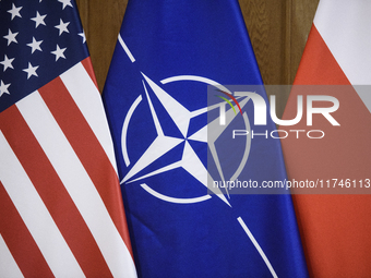 The flags of the USA, NATO, and Poland are pictured before the U.S. soldiers' medal award ceremony at the Ministry of Defence in Warsaw, Pol...