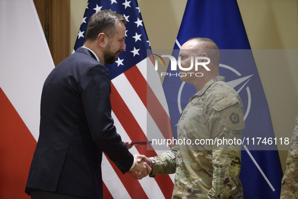 Poland's Deputy Prime Minister and Defence Minister, Wladyslaw Kosiniak-Kamysz, awards U.S. soldiers stationed in Poland for their service i...