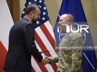 Poland's Deputy Prime Minister and Defence Minister, Wladyslaw Kosiniak-Kamysz, awards U.S. soldiers stationed in Poland for their service i...