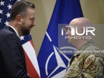 Poland's Deputy Prime Minister and Defence Minister, Wladyslaw Kosiniak-Kamysz, awards U.S. soldiers stationed in Poland for their service i...