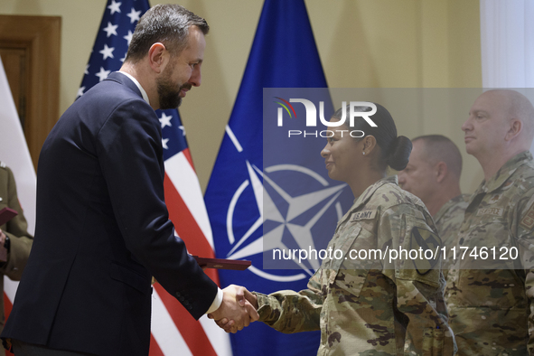 Poland's Deputy Prime Minister and Defence Minister, Wladyslaw Kosiniak-Kamysz, awards U.S. soldiers stationed in Poland for their service i...