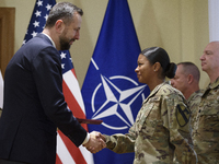 Poland's Deputy Prime Minister and Defence Minister, Wladyslaw Kosiniak-Kamysz, awards U.S. soldiers stationed in Poland for their service i...