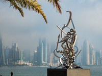 People fish at the Doha Corniche in heavy fog in Doha, Qatar, on November 6, 2024. (