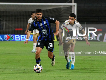 Rodrigo Lopez #7 of Pumas de la UNAM and Alan Medina #11 of Queretaro fight for the ball during the match corresponding to round 16 of the A...