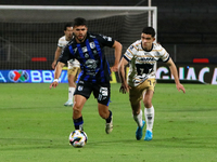 Rodrigo Lopez #7 of Pumas de la UNAM and Alan Medina #11 of Queretaro fight for the ball during the match corresponding to round 16 of the A...